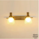 Applique murale dorée salle de bain