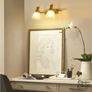 Applique murale dorée salle de bain