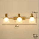 Applique murale dorée salle de bain