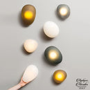 Applique murale forme galet