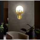 Applique murale main avec boule